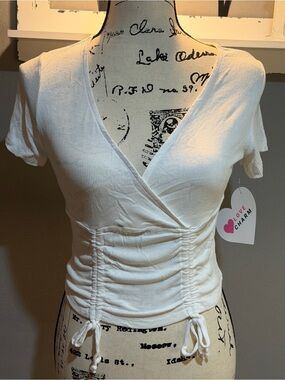 Love Charm White Ribbed V‑Neck Ruched Drawstring Crop Top
